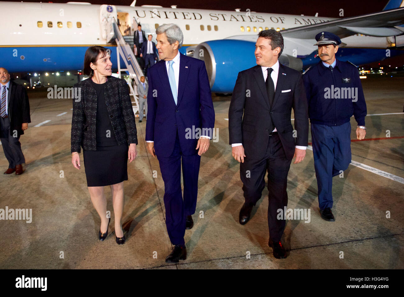 U.S. Secretary of State John Kerry walks with Argentina National Director of Protocol Ambassador Betina de Fonseca, and Chief of the Air Base Commodore Ruben Esteban Benza after he arrived at Jorge Newbery Airfield in Buenos Aires, Argentina, in the early morning hours of August 4, 2016, to meet with U.S. and Argentine business leaders, and for bilateral meetings with Argentina President Mauricio Macri and Foreign Minister Susana Malcorra. Stock Photo