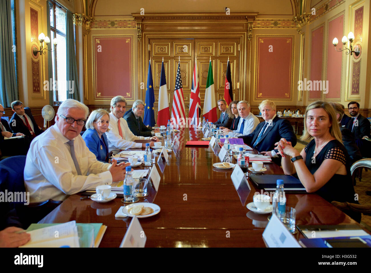 U.S. Secretary of State John Kerry and several colleagues – German Foreign Minister Frank-Walter Steinmeier, Italian Foreign Minister Paolo Gentiloni, French Foreign Minister Jean-Marc Ayrault, and European Union High Representative for Foreign Affairs Federica Mogherini – sit with newly installed British Foreign Secretary Boris Johnson on July 19, 2016, in the Grand Locarno Room at the Foreign &amp; Commonwealth Office in London, U.K., before a group conversation about Syria. Stock Photo