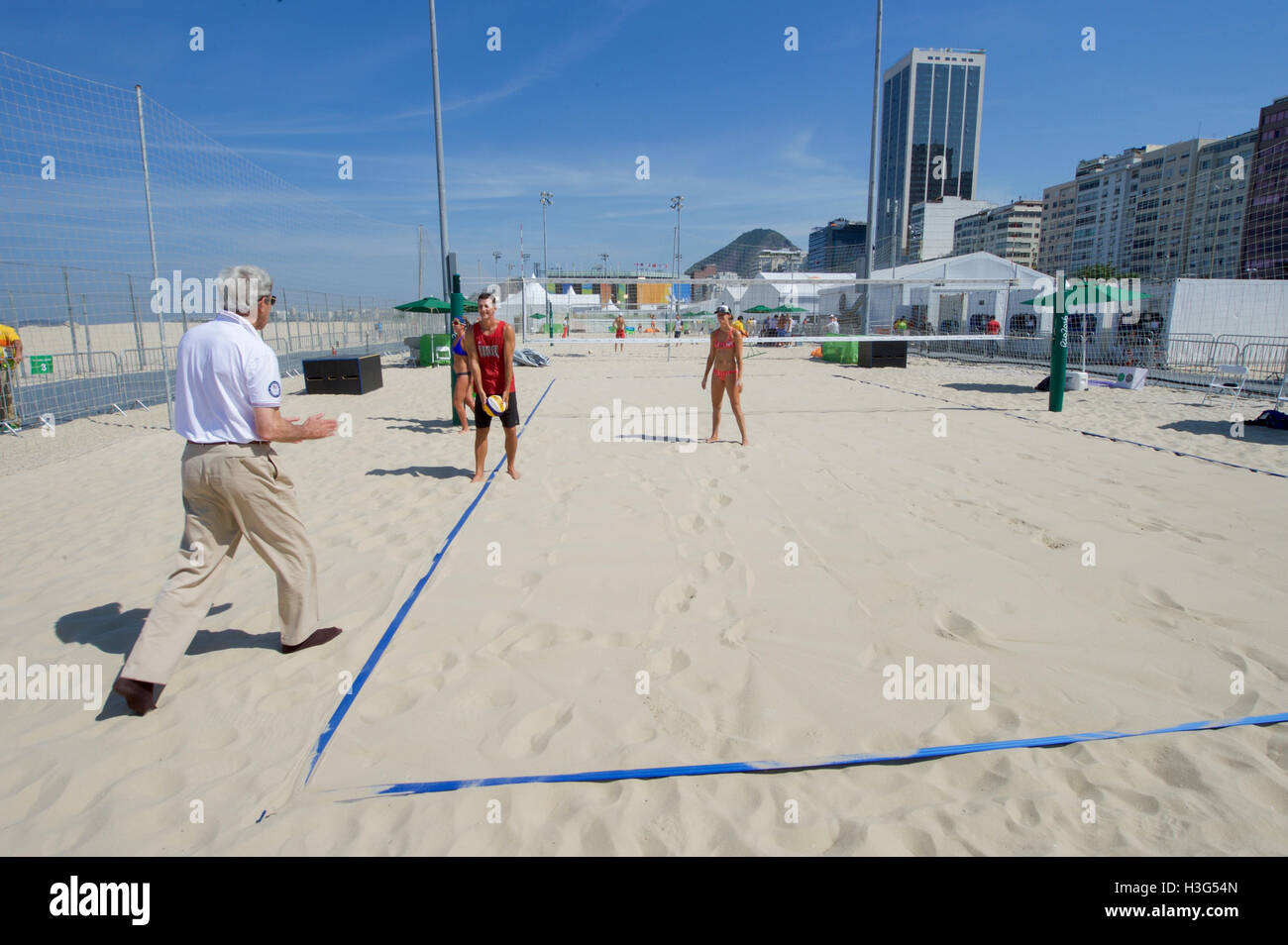 U.S. Secretary of State John Kerry prepares to play with U.S. Olympic women's beach volleyball players on the Copacobana beach in Rio de Janiero, Brazil, on August 6, 2016, as he and his fellow members of the U.S. Presidential Delegation attend the Summer Olympics. Stock Photo