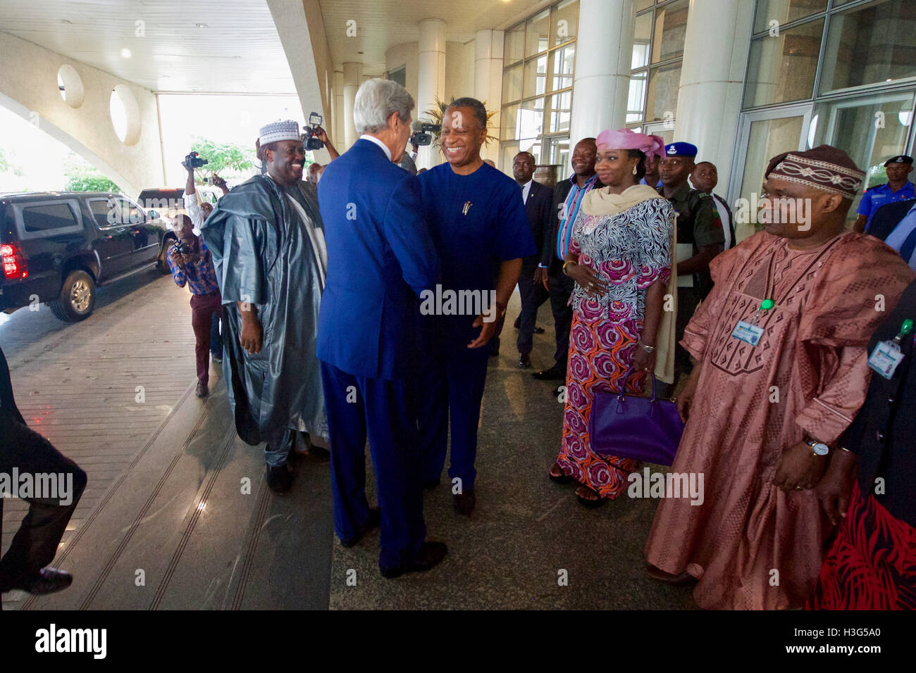 U.S. Secretary of State John Kerry shakes hands with Nigerian Foreign Minister Geoffrey Onyeama on August 23, 2016, after arriving at Ministry of Foreign Affairs in Abuja, Nigeria, following meetings with Nigerian President Muhummadu Buhari and Governor’ of the country’s Northern region. Stock Photo