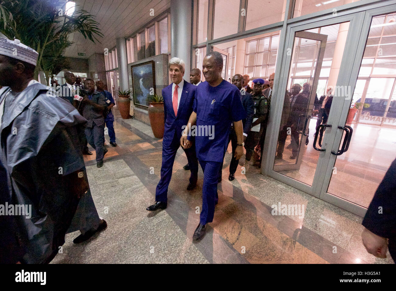U.S. Secretary of State John Kerry walks with Nigerian Foreign Minister Geoffrey Onyeama on August 23, 2016, after arriving at Ministry of Foreign Affairs in Abuja, Nigeria, following meetings with Nigerian President Muhummadu Buhari and Governor’ of the country’s Northern region. Stock Photo