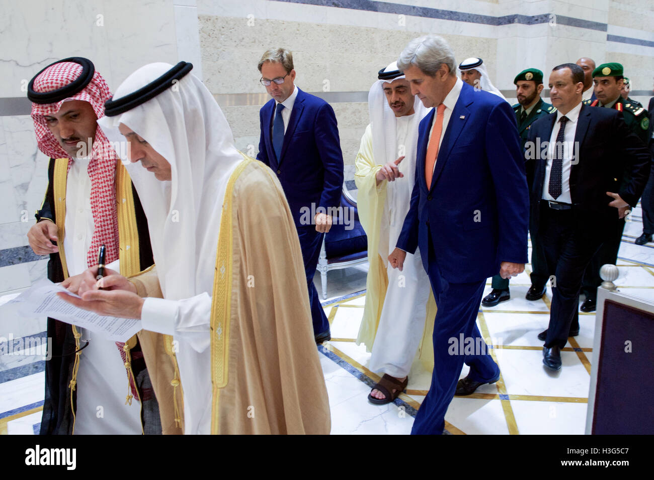 U.S. Secretary of State John Kerry walks with United Kingdom Under Secretary of Foreign Affairs Tobias Ellwood and United Arab Emirates Foreign Minister Abdullah bin Zayed on August 25, 2016, in the Royal Terminal 1 at King Abdulaziz International Airport in Jeddah, Saudi Arabia before a five-way meeting focused on Yemen. [State Department photo/ ] Stock Photo