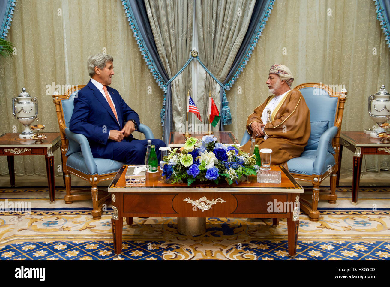 U.S. Secretary of State John Kerry sits with Omani Foreign Minister Yusuf bin Alawi bin Abdullah on August 25, 2016, in the Royal Terminal 1 at King Abdulaziz International Airport in Jeddah, Saudi Arabia, amid a regional meeting focused on Yemen. Stock Photo