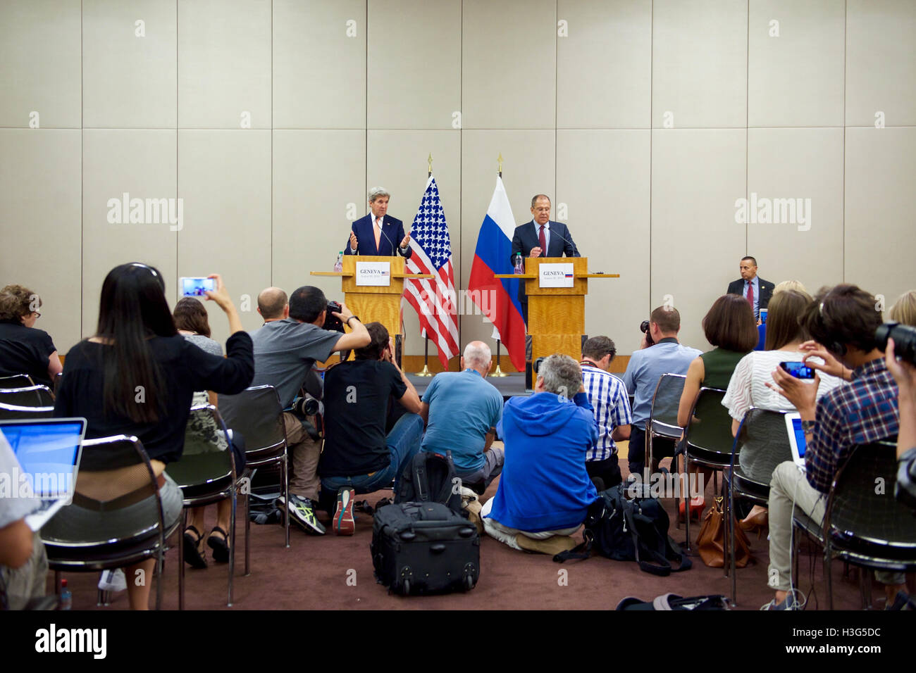 U.S. Secretary of State John Kerry speaks as he and Russian Foreign Minister Sergey Lavrov address reporters during a joint news conference following a bilateral meeting focused on Syria held August 26, 2016, at the President Wilson Hotel in Geneva, Switzerland. Stock Photo
