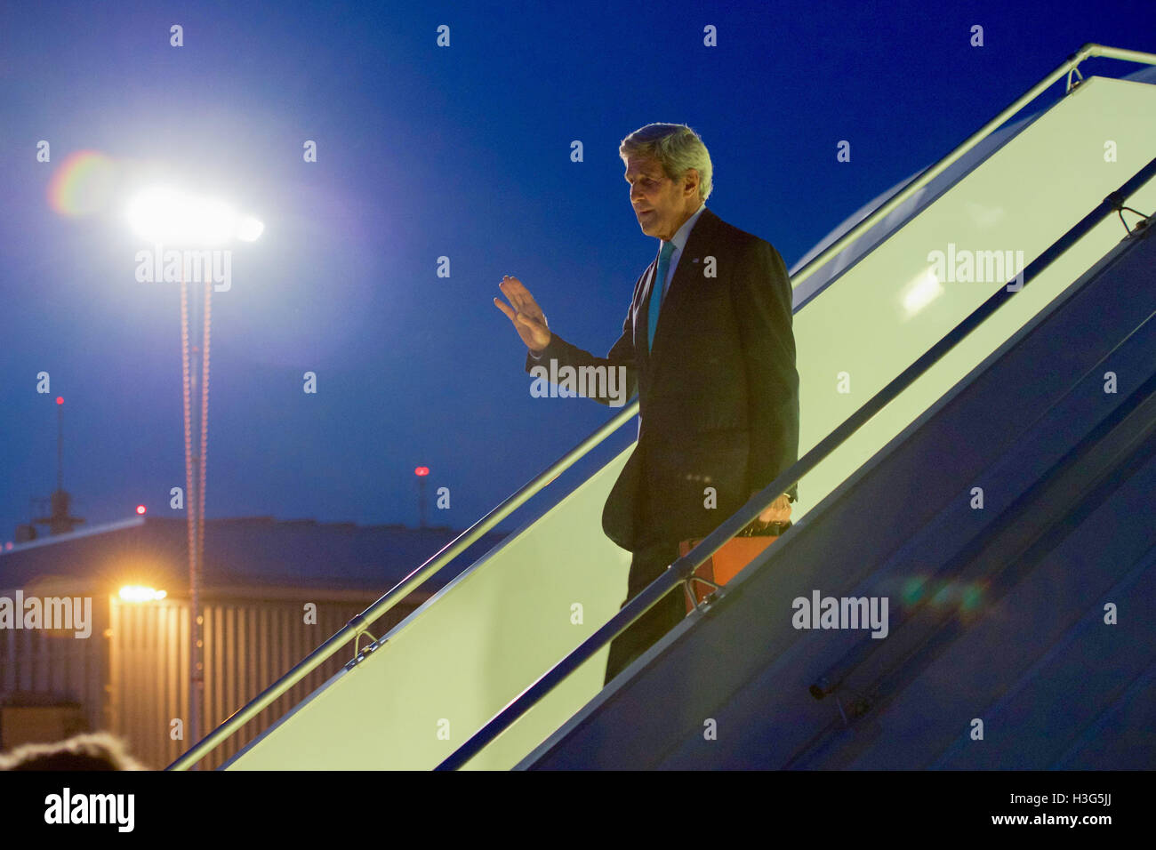 U.S. Secretary of State John Kerry waves as he deplanes on September 9, 2016, at the Geneva Airport in Geneva, Switzerland, as he arrives following an overnight flight from Washington for meetings with Russian Foreign Minister Sergey Lavrov focused on Syria. Stock Photo