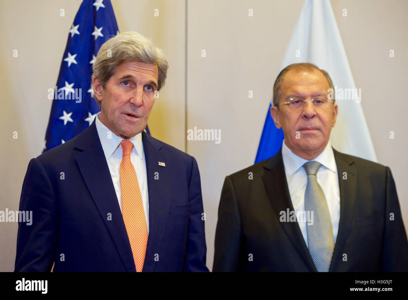 U.S. Secretary of State John Kerry, flanked by Russian Foreign Minister Sergey Lavrov, answers a reporter's question on September 9, 2016, at the Hotel President Wilson in Geneva, Switzerland, before they begin a bilateral meeting focused on Syria. Stock Photo
