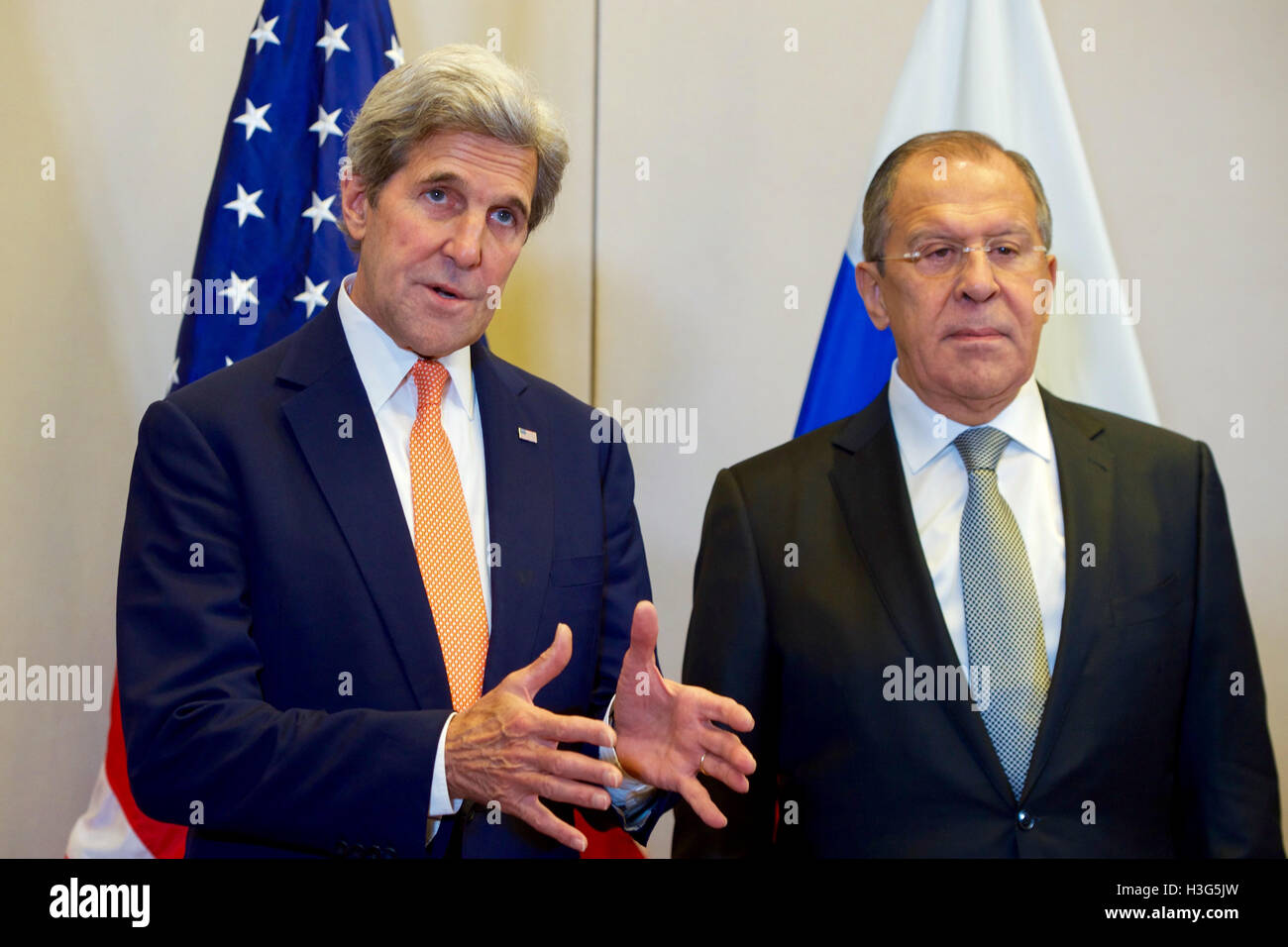 U.S. Secretary of State John Kerry, flanked by Russian Foreign Minister Sergey Lavrov, answers a reporter's question on September 9, 2016, at the Hotel President Wilson in Geneva, Switzerland, before they begin a bilateral meeting focused on Syria. Stock Photo