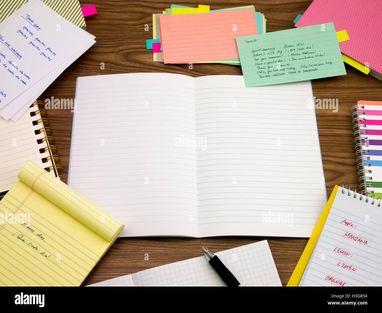 Spanish; Learning New Language Writing Words on the Notebook Stock