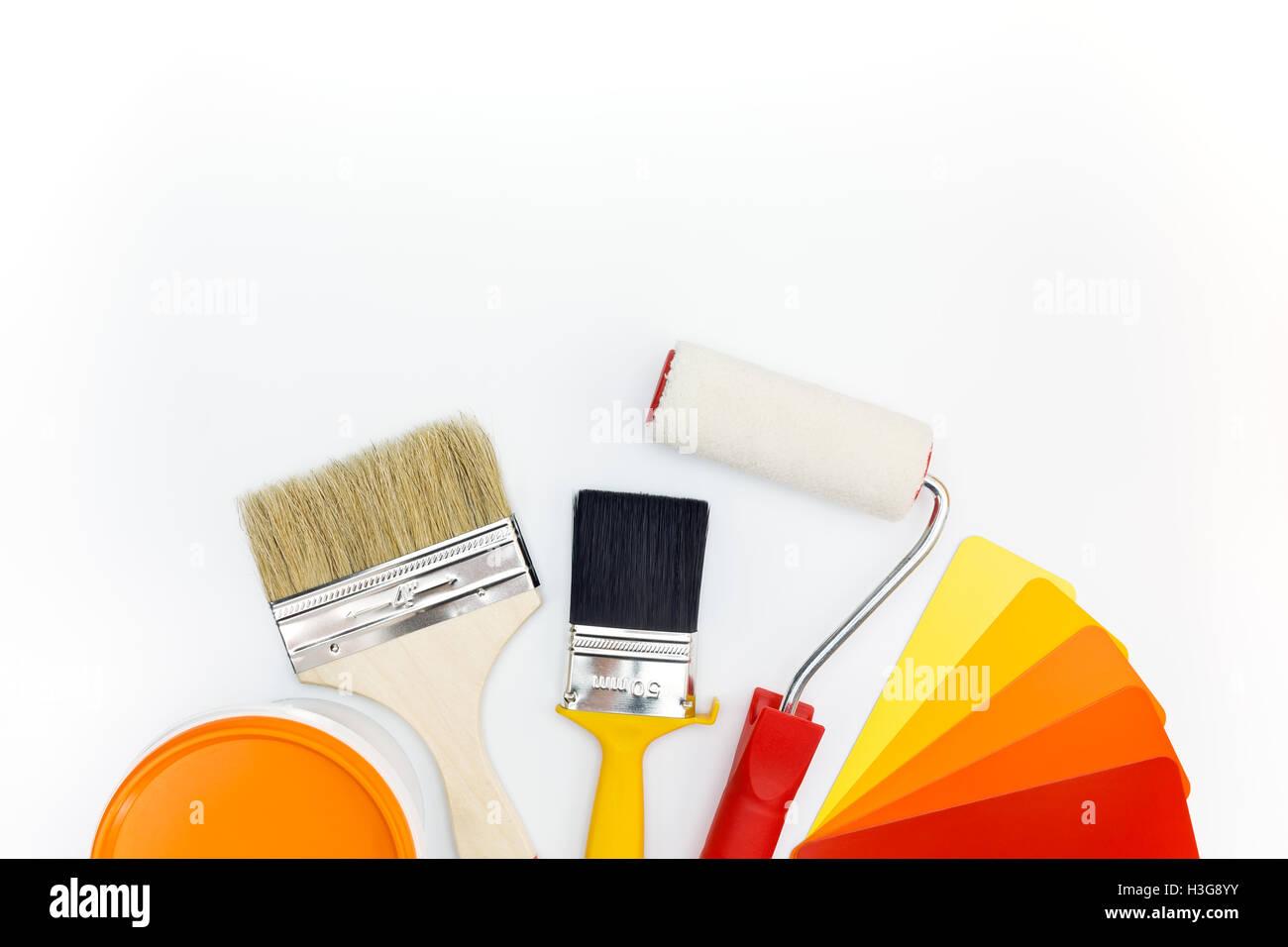 brushes and roller with color guide and paint can Stock Photo Alamy