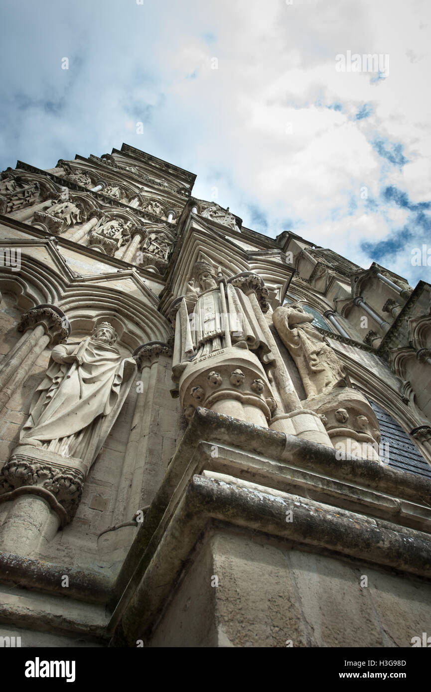 Stone statues carved into the exterior wall of Salisbury Cathedral an