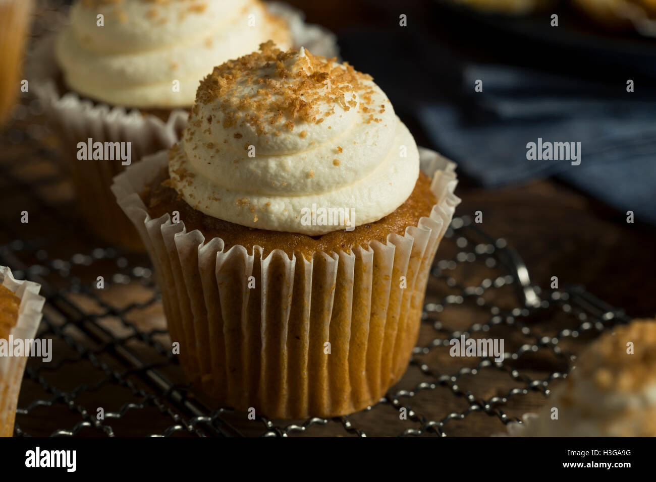 Sweet Homemade Pumpkin Spice Cupcakes with Frosting Stock Photo