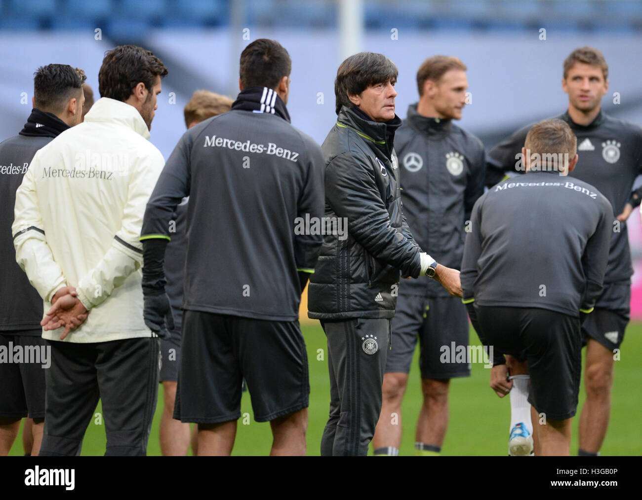 Hamburg, Germany. 7th Oct, 2016. Headcoach of the German national soccer team, Joachim Löw (M) stands during a training session in the Volksparstadium in Hamburg, Germany, 7 October 2016. Germany is to play against the Czech Prepublic to qualify for the next World Cup on the 8 October 2016. Photo: Daniel Bockwoldt/dpa/Alamy Live News Stock Photo