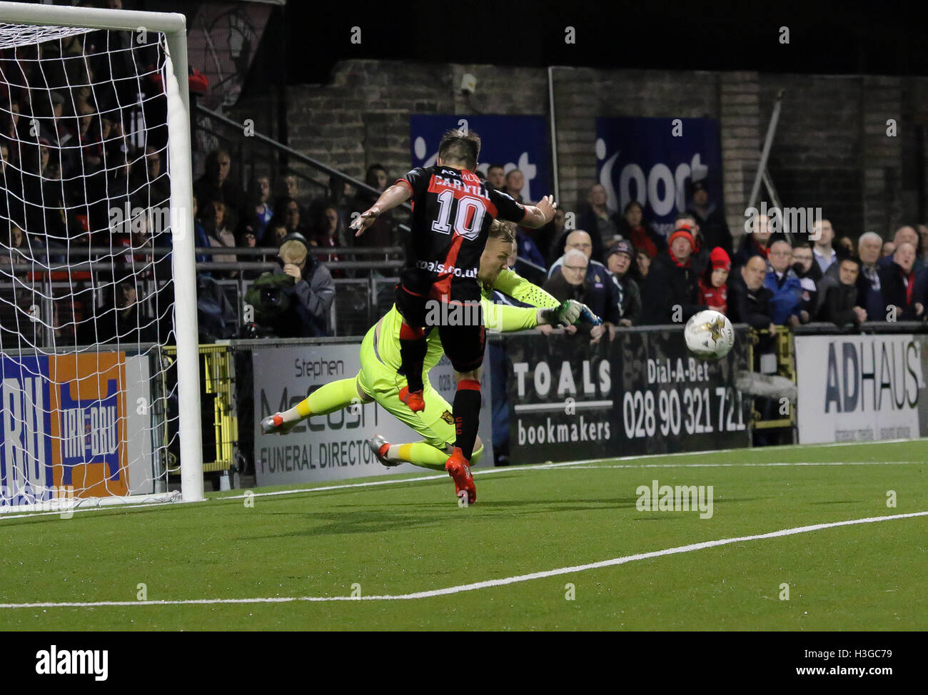 Seaview, Belfast, UK. 01 Oct 2016 - IRN BRU Cup (4th Round), Crusaders 1 Livingston 2. Livingston goalkeeper Gary Maley saves from Michael Carvill. David Hunter/Alamy Live News. Stock Photo