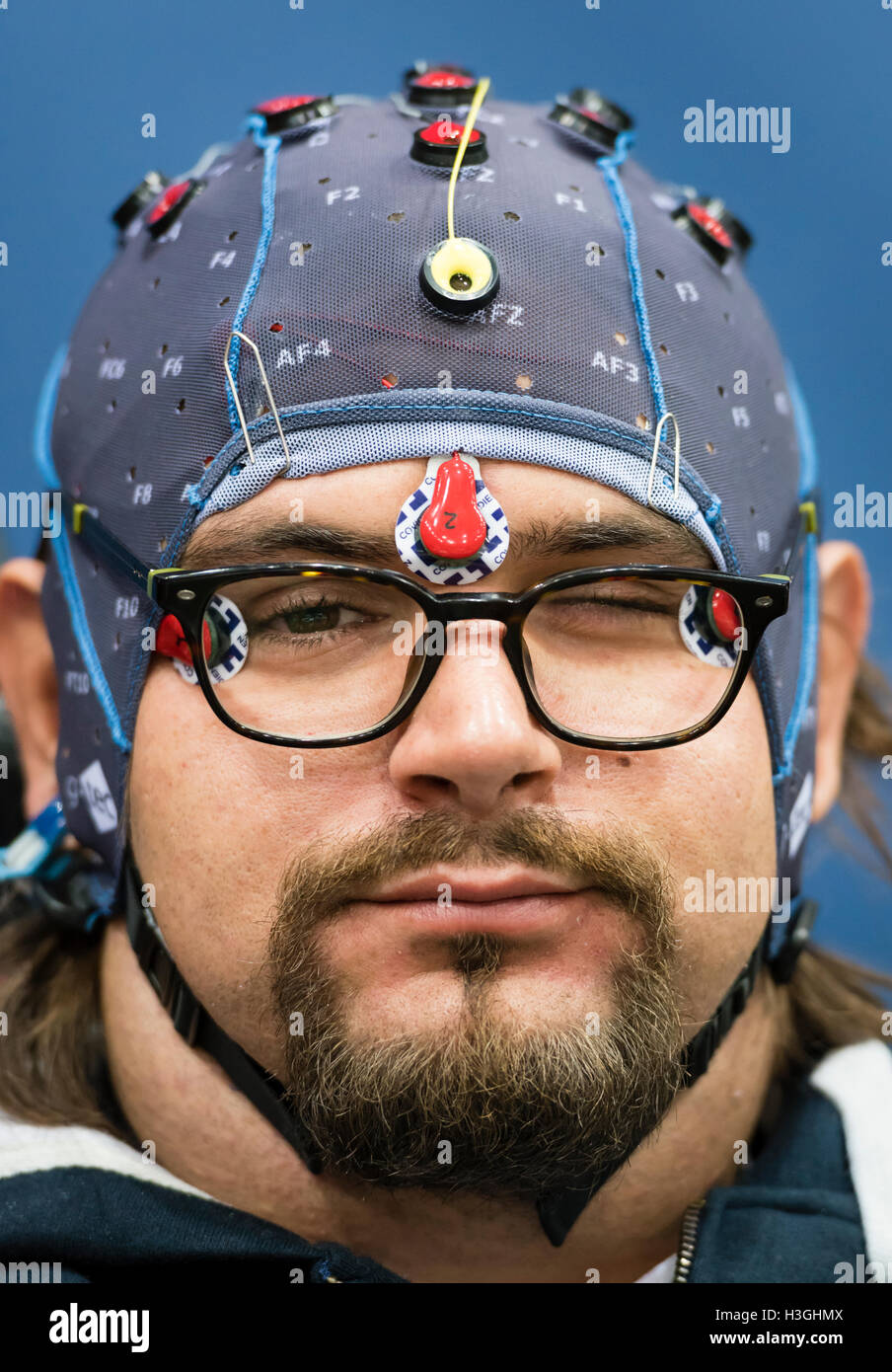 Kloten, Switzerland - 8 October 2016: Numa Poujouly is winking at the photographer before the BCI (Brain-Computer Interface) race at Cybathlon, the first championship for racing pilots with disabilities using bionic devices at the Swiss Arena in Kloten (Zurich), Switzerland. At the BCI race, the paraplegic BCI athlete is piloting an avatar through a computer game just with his thoughts. Later that day, Numa Poujouly finished first in the final and won the first Cybathlon BCI gold medal. Credit:  Erik Tham/Alamy Live News Stock Photo