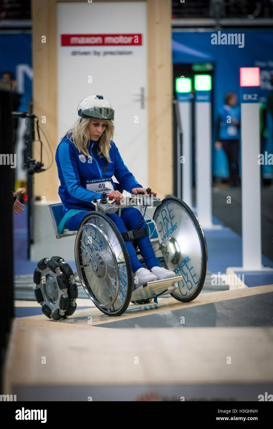 Kloten, Switzerland. 8th Oct, 2016. Kalliopi Loufakil (GRC) passes a wheelchair obstacle course at Cybathlon, the first championship for racing pilots with disabilities using bionic devices at the Swiss Arena in Kloten (Zurich), Switzerland. Organized by the Swiss Federal Institute of Technology (ETH) in Zurich, Cybathlon brings together interdisciplinary teams of bio-engineers, scientists and athletes with physical disabilities to compete in solving everyday tasks and to demonstrate how technology enables them to overcome physical limitations of their body. Credit:  Erik Tham/Alamy Live News Stock Photo