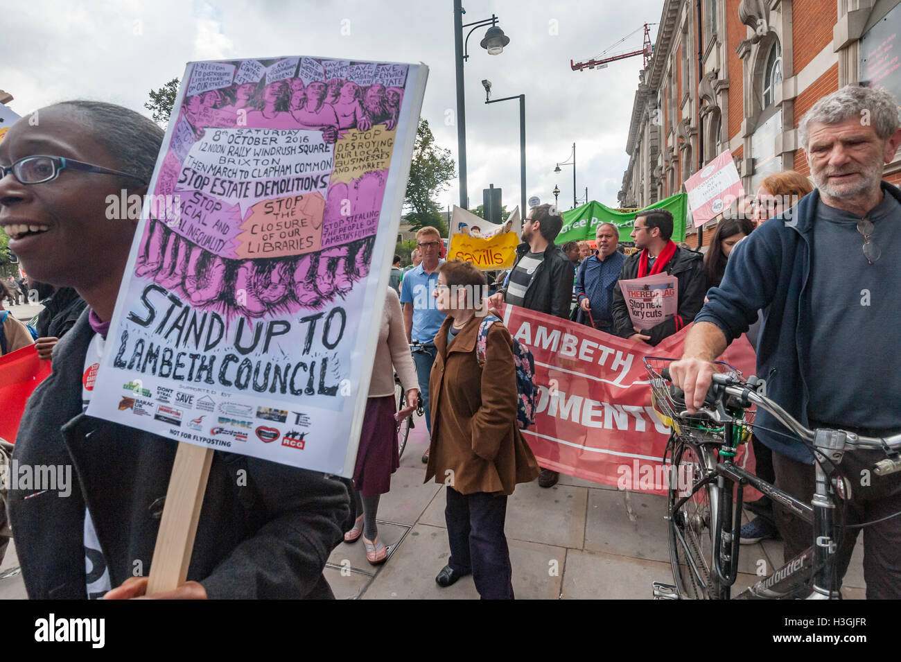 London, UK. 8th October 2016. Campaigners in Lambeth, the most unequal borough in the whole of England and Wales, march from Brixton to a picnic on Clapham Common launching a series of events against the policies of the council, calling on it to stop demolishing council estates, closing libraries and driving out local businesses with the closure of the Brixton Arches. They accuse the Labour council of financial waste and 'destroying our communities, racial and social inequality' and 'stealing the people of Lambeth's future. Credit:  Peter Marshall/Alamy Live News Stock Photo