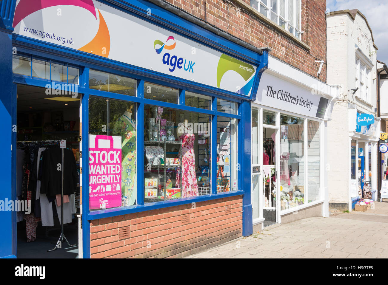 Row of three charity shops, Market Place, Swaffham, Norfolk, England, United Kingdom Stock Photo