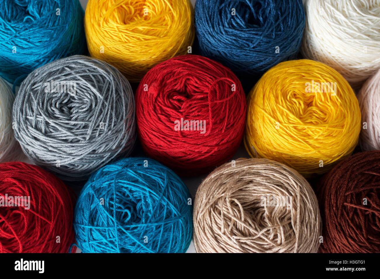 Balls of wool cotton silk yarn set top view Stock Photo