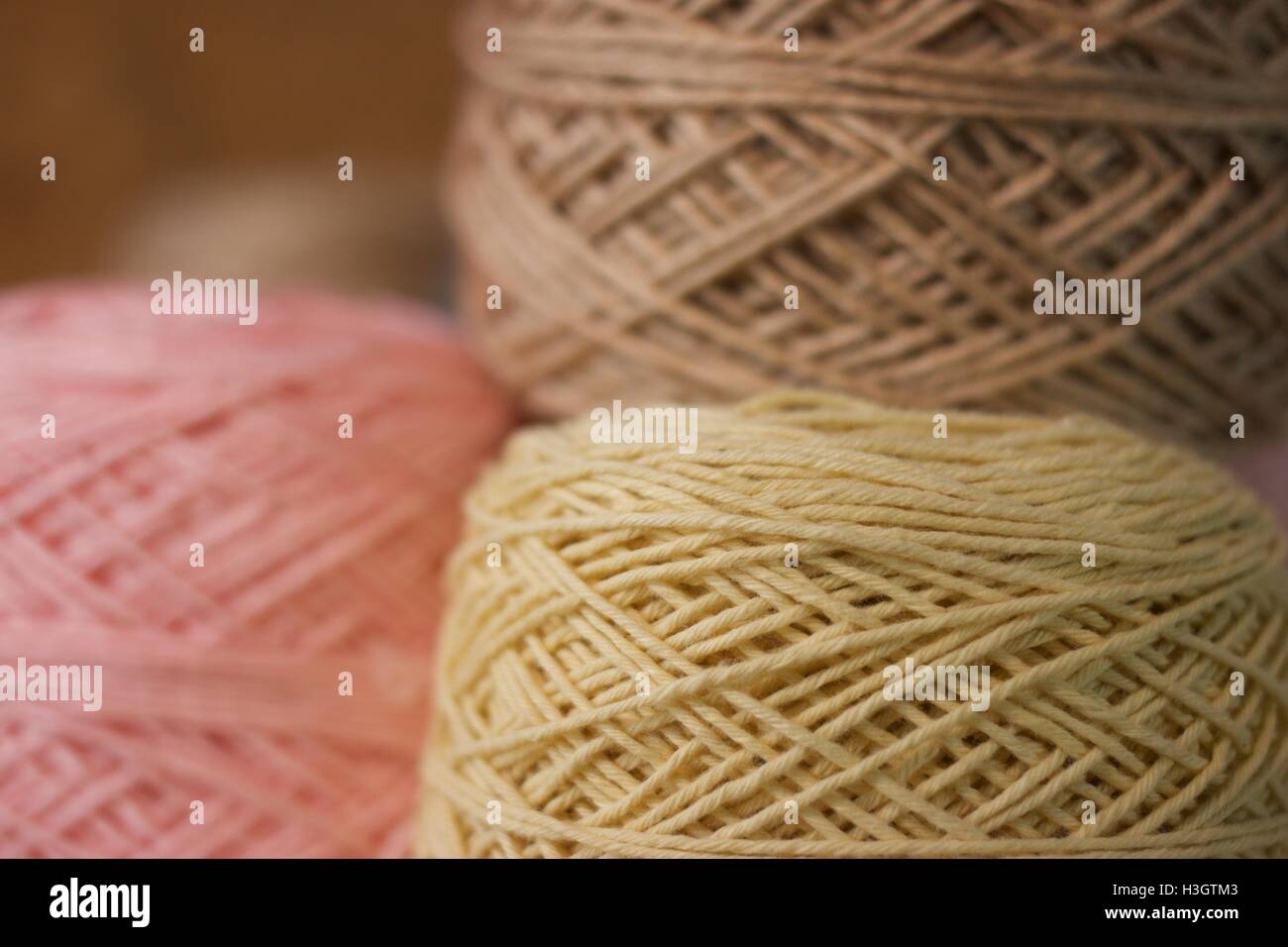 Balls of wool cotton silk Brown Brown Crean and Pink close up Stock Photo