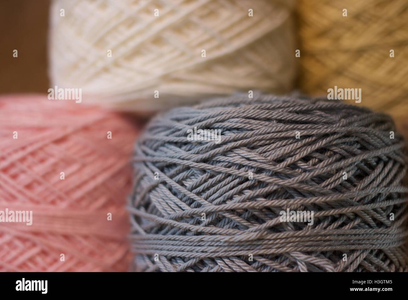 Balls of wool cotton silk Brown Pink White and Gray close up Stock Photo