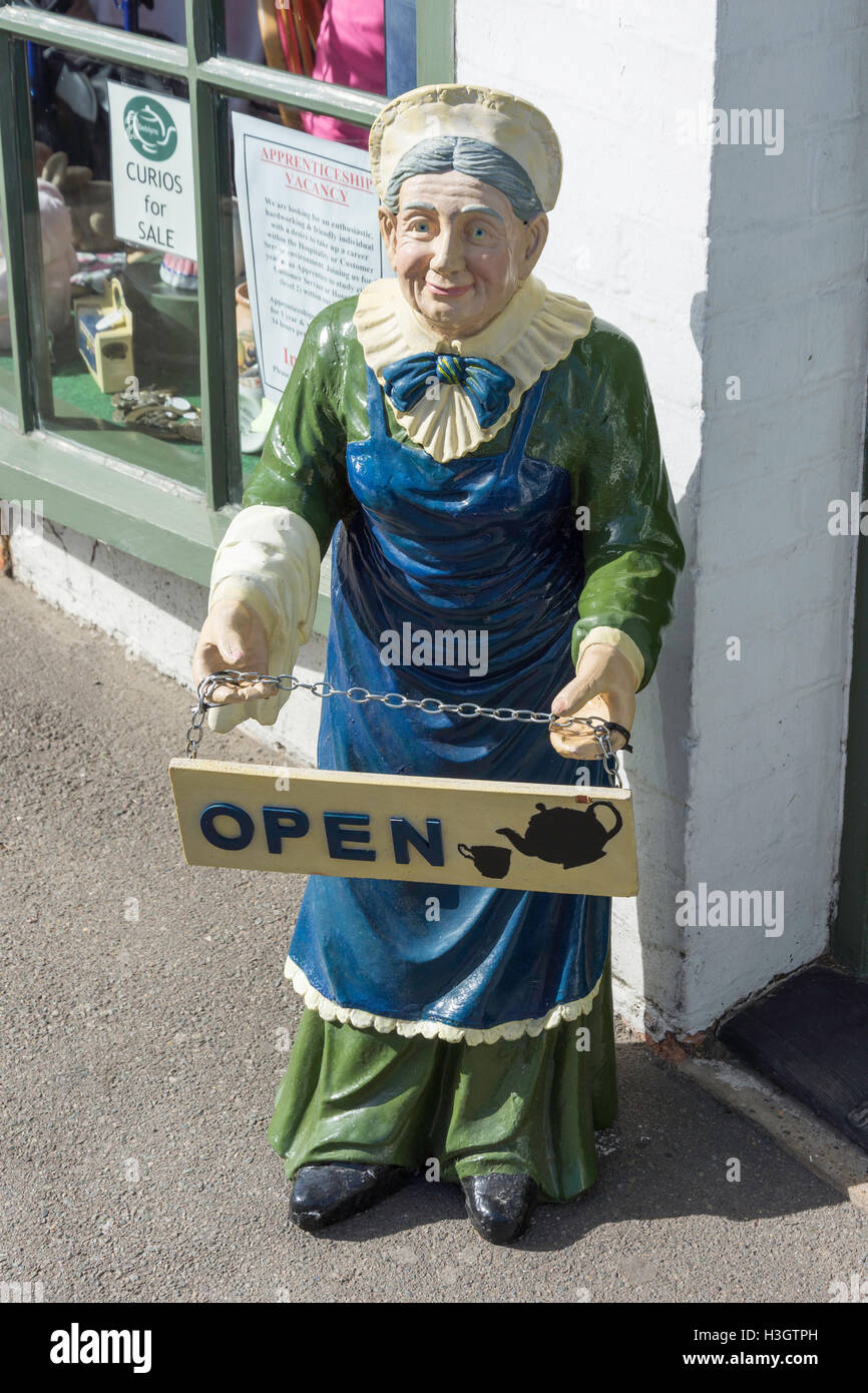 Open sign and statue outside Deblyn's Teashop, High Street, New Romney, Kent, England, United Kingdom Stock Photo