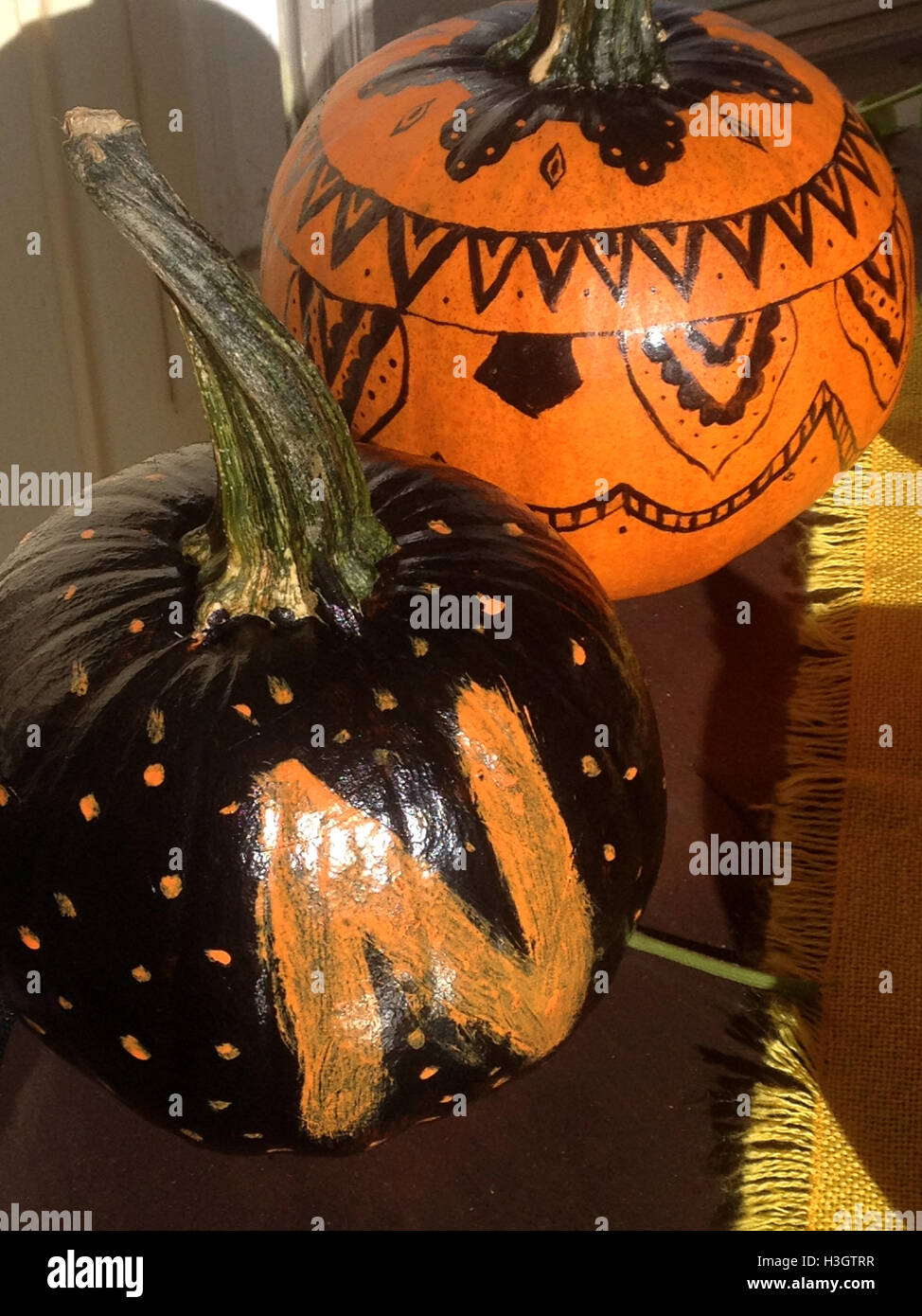 Painted pumpkins for Halloween, in black and orange Stock Photo - Alamy