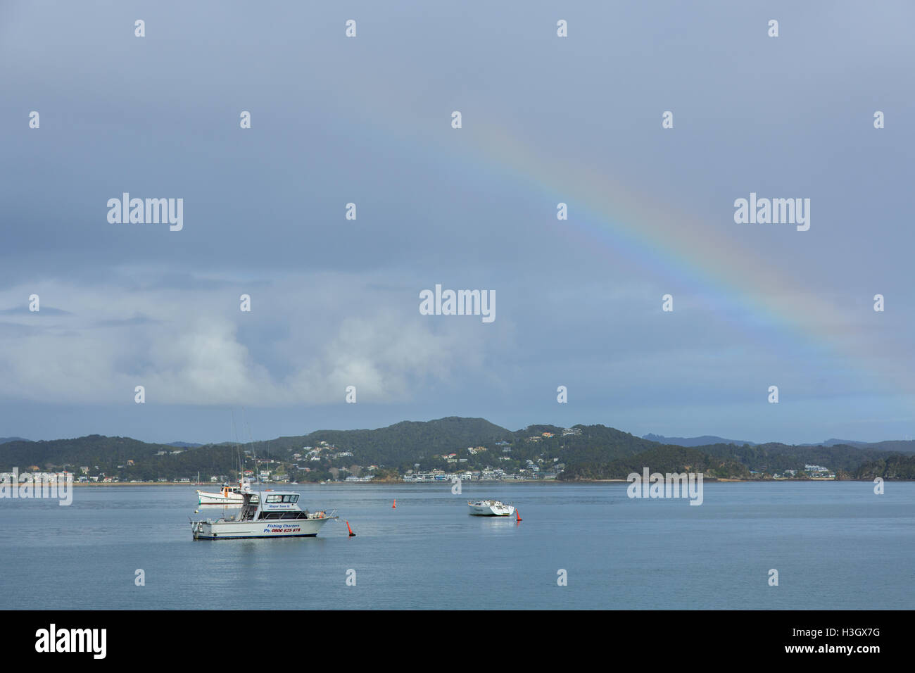 A rainbow over the Bay of Islands near Paihia in New Zealand Stock Photo