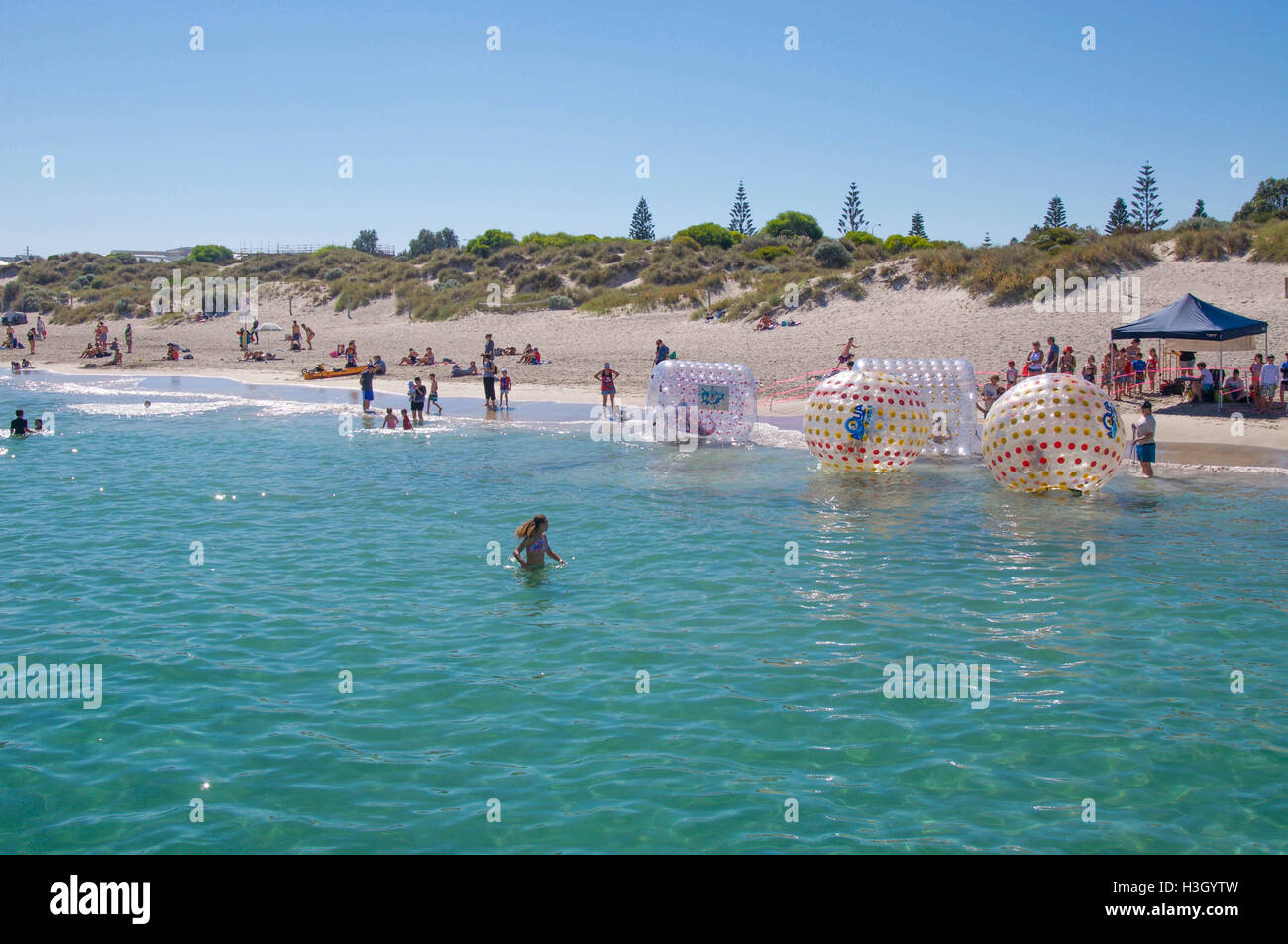 Coogee,WA,Australia-April 3,2016:People at the Coogee Beach Festival with inflatable walking on water balls in Coogee, Western Australia. Stock Photo