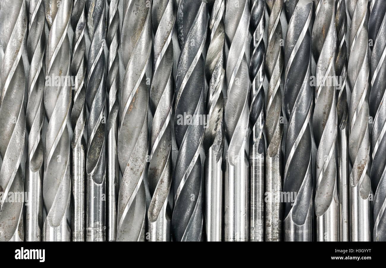 Various used metal drill bits pattern background Stock Photo