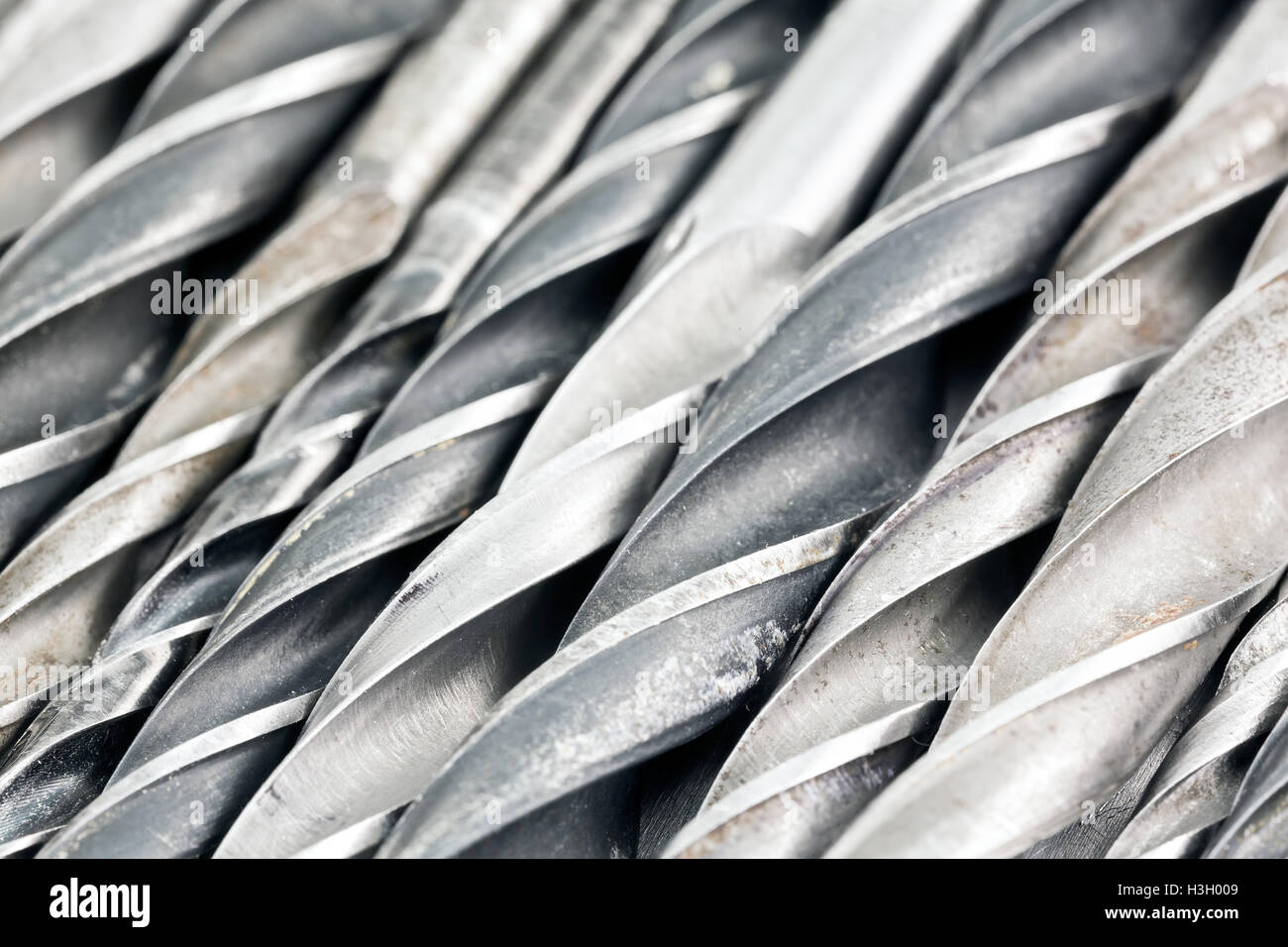 Various used metal drill bits pattern background Stock Photo