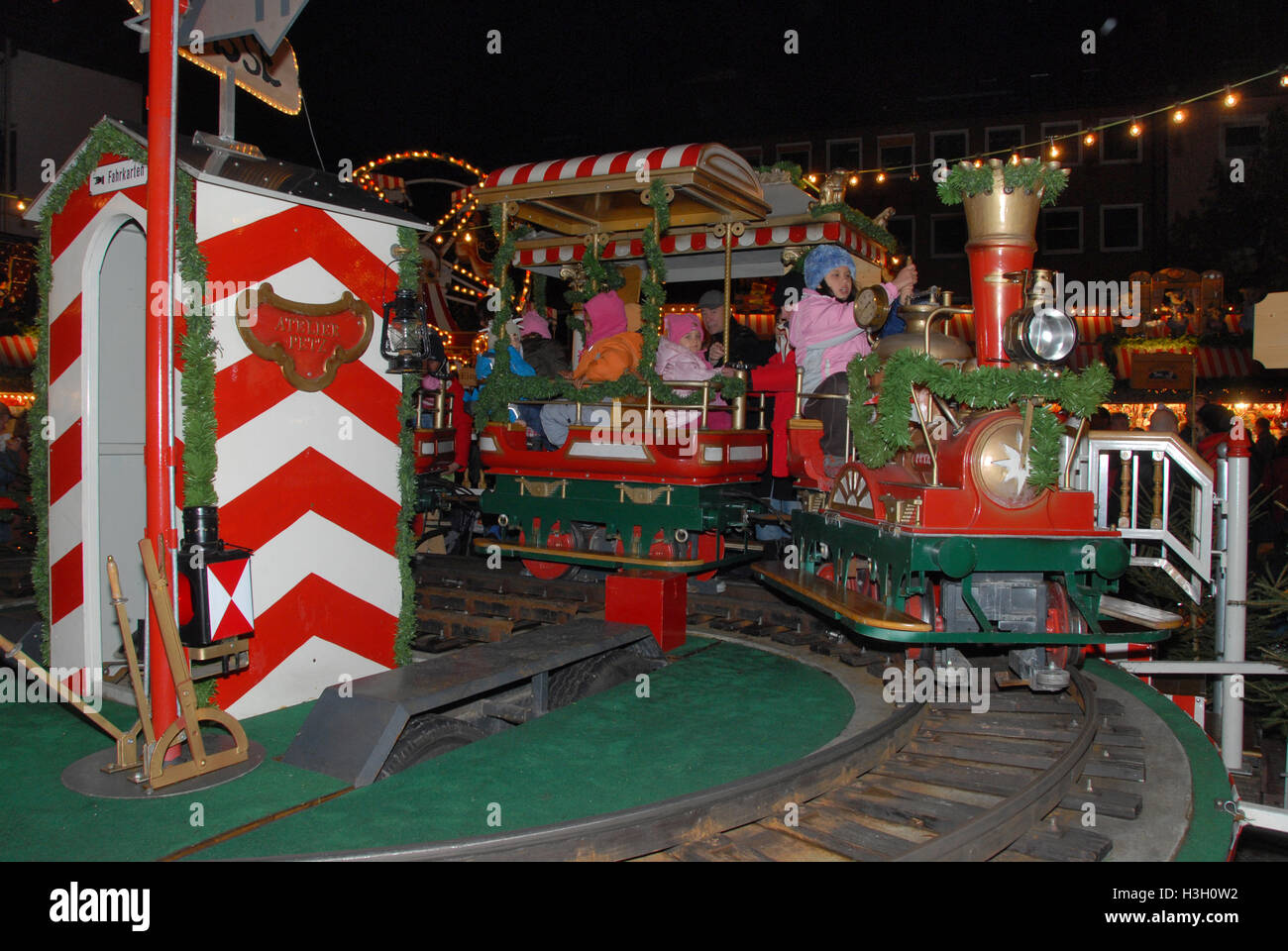 Children enjoying a  train ride at the Children's Christmas market as part of the Nuremberg's Christmas Market in Nuremberg, Ger Stock Photo