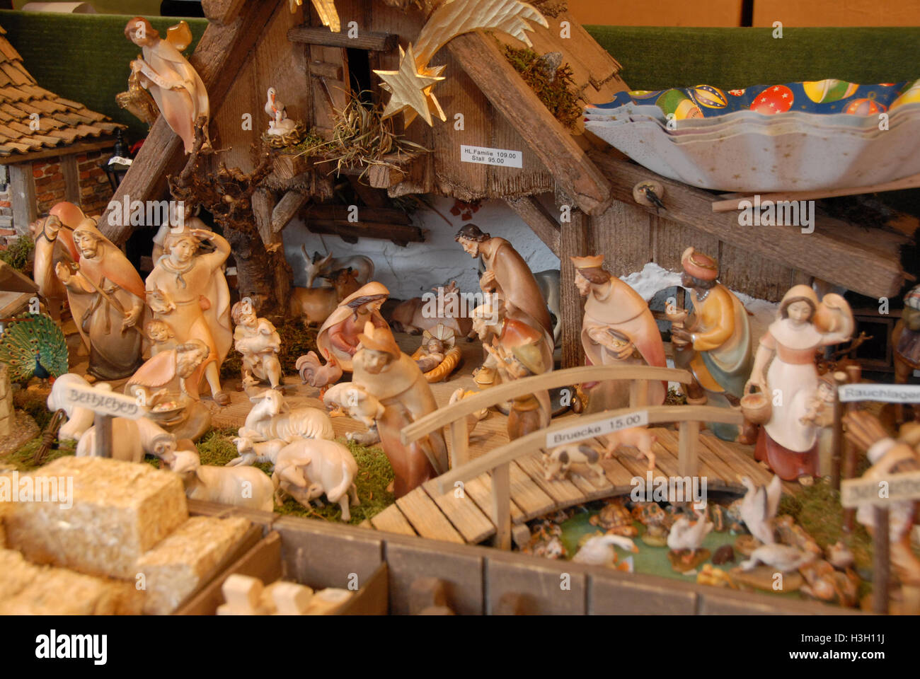 Handmade nativity figures in a nativity scene on sale at the Nuremberg