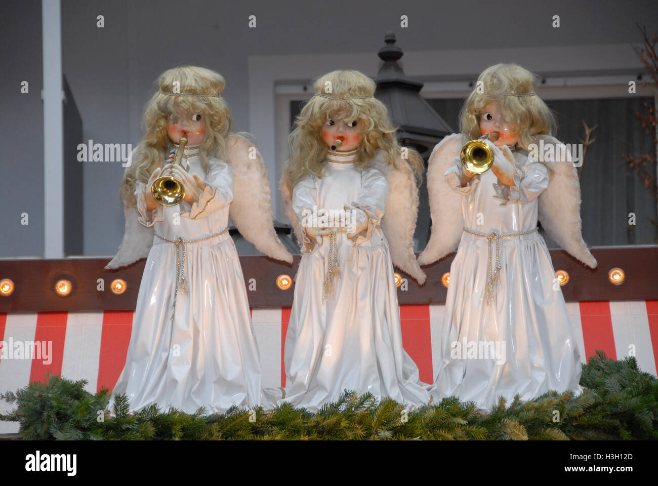 Angel puppets mounted on a roof of one of the Christmas log stalls at ...