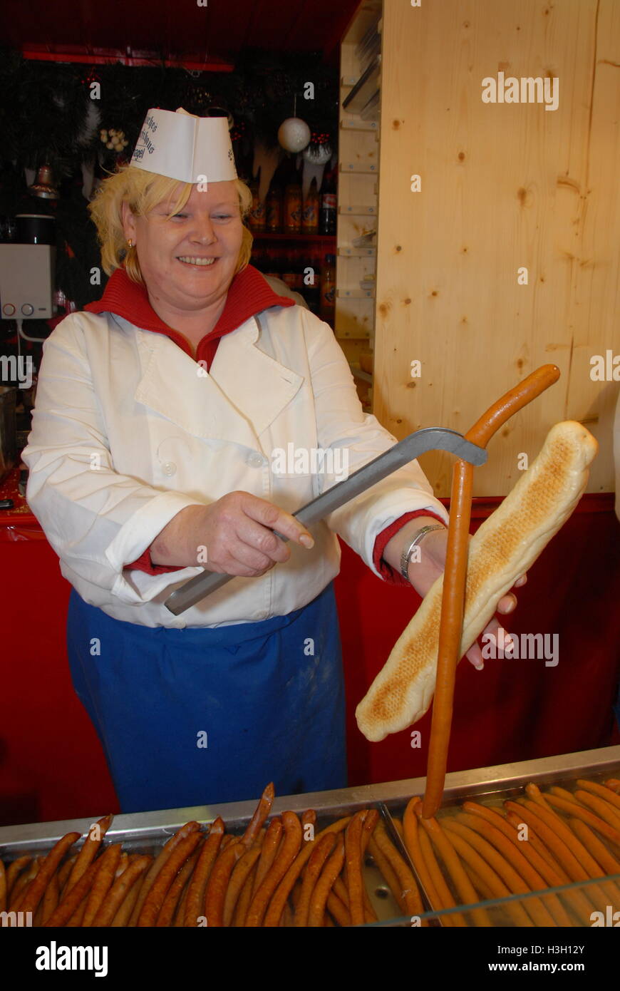 A cook serving a halfmetrelong sausage hot dog at the Nuremberg