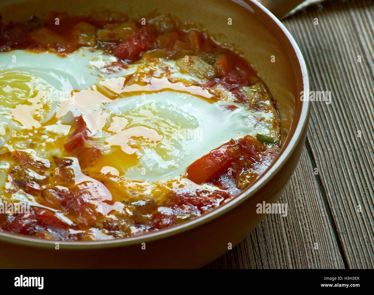 Spanishstyle baked eggs Stock Photo Alamy