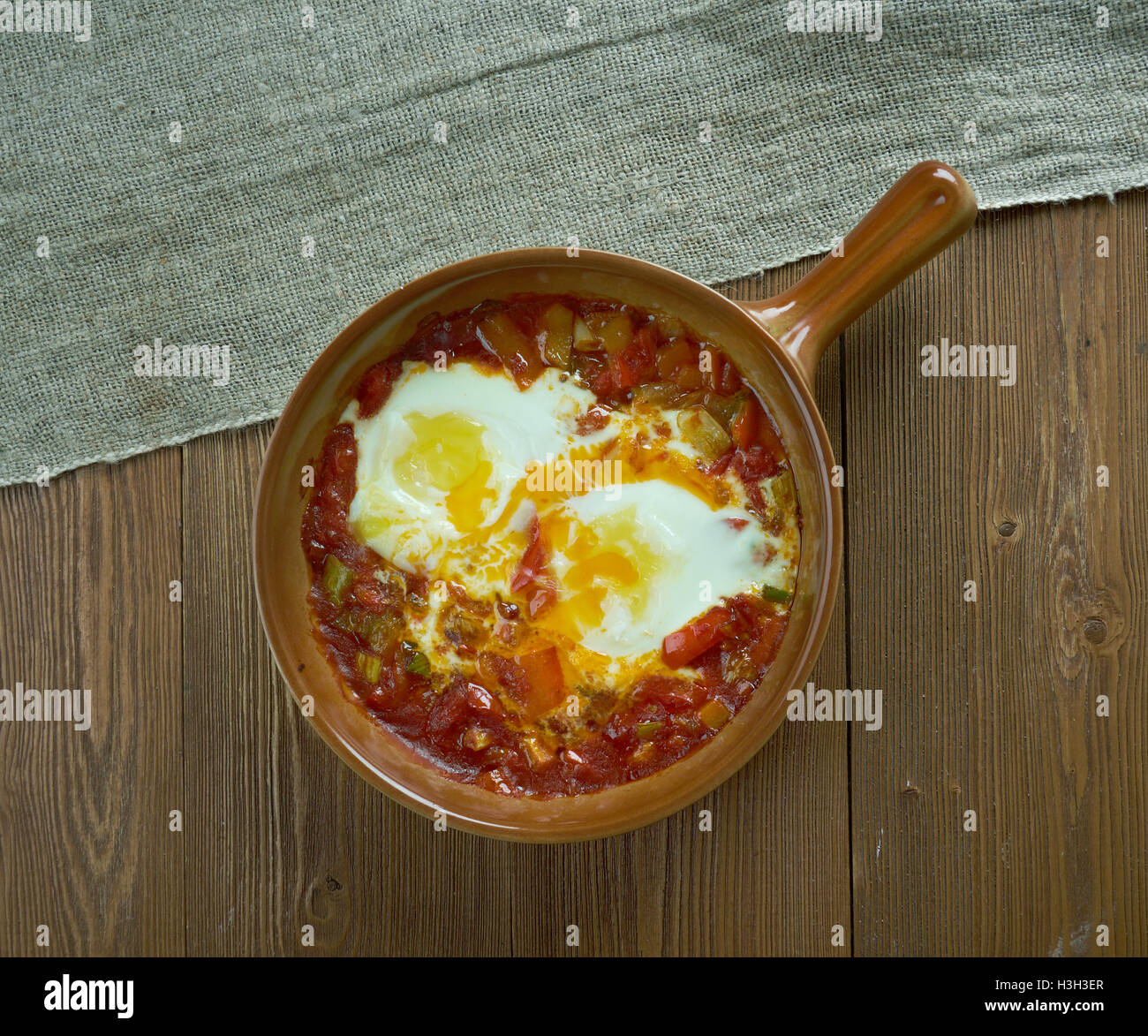 Spanishstyle baked eggs Stock Photo Alamy