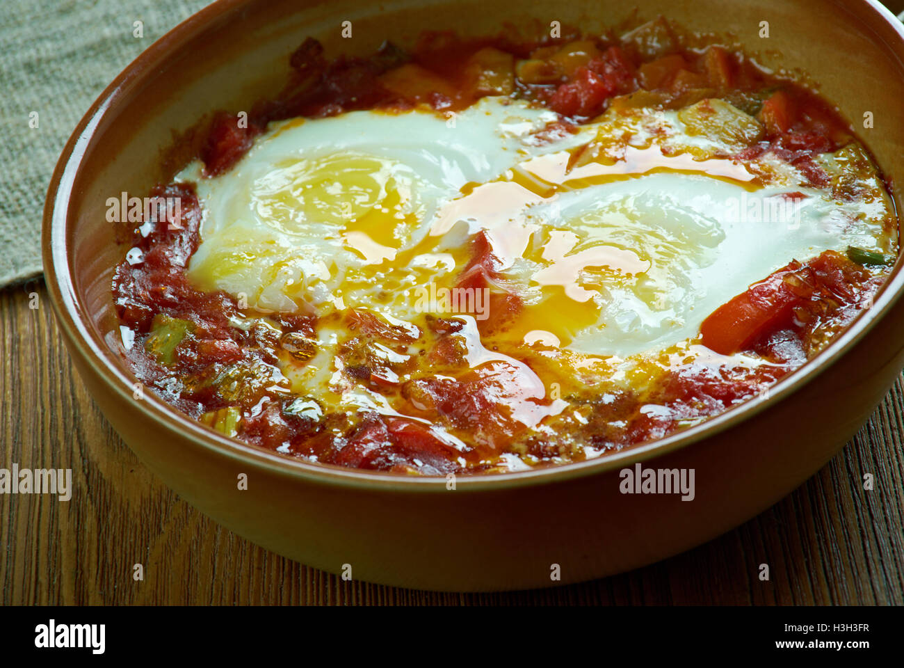 Spanishstyle baked eggs Stock Photo Alamy