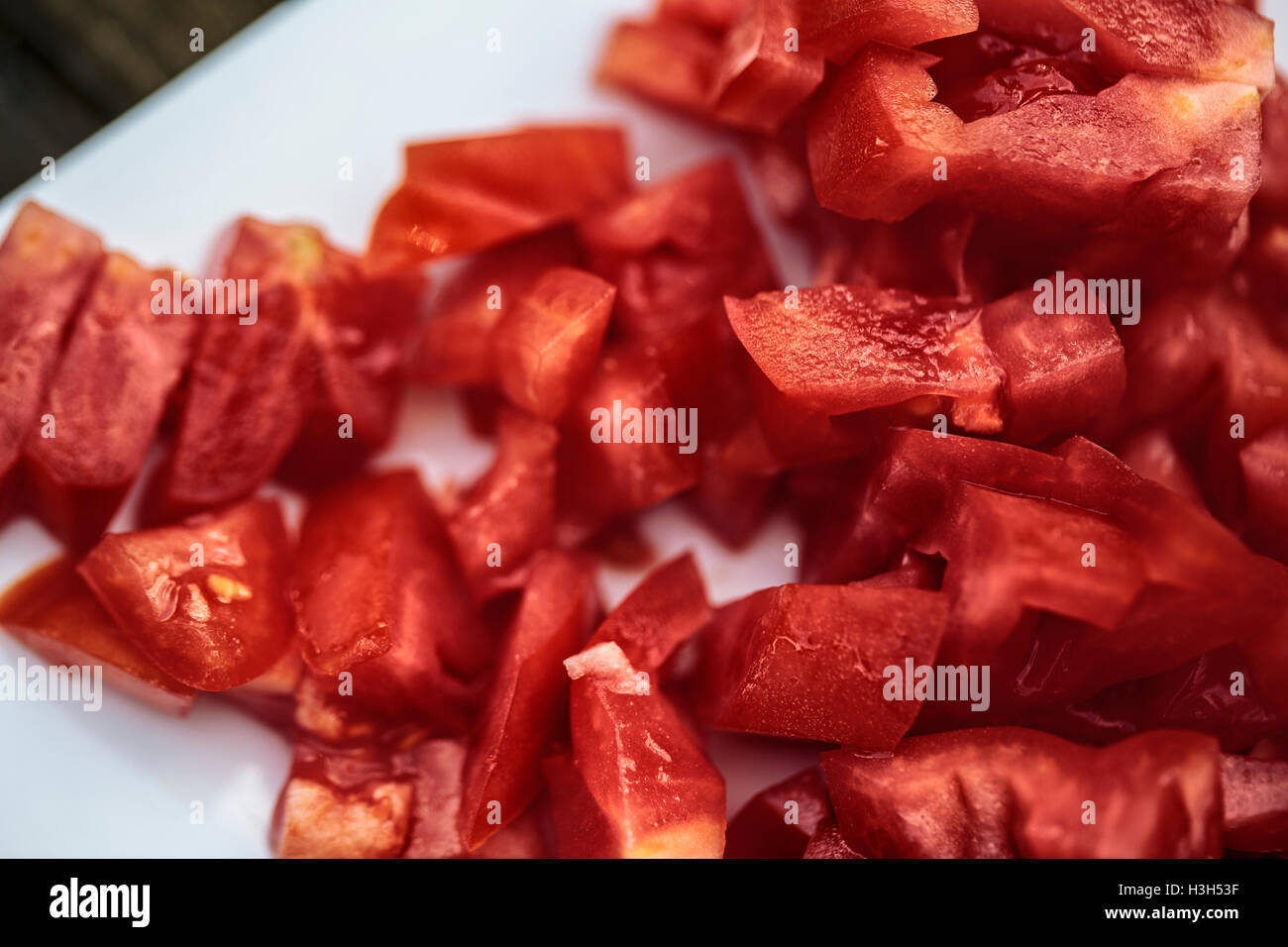 Close Up of Chopped pieces of ripe Tomato Stock Photo