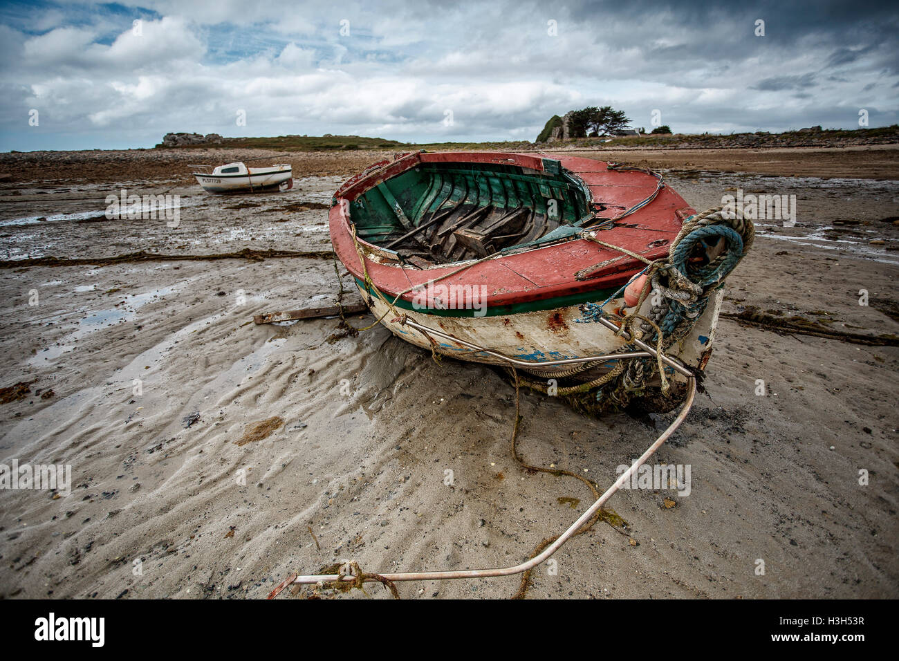 View of Old Boats in Brittany France on the shore during ebb tide Stock Photo
