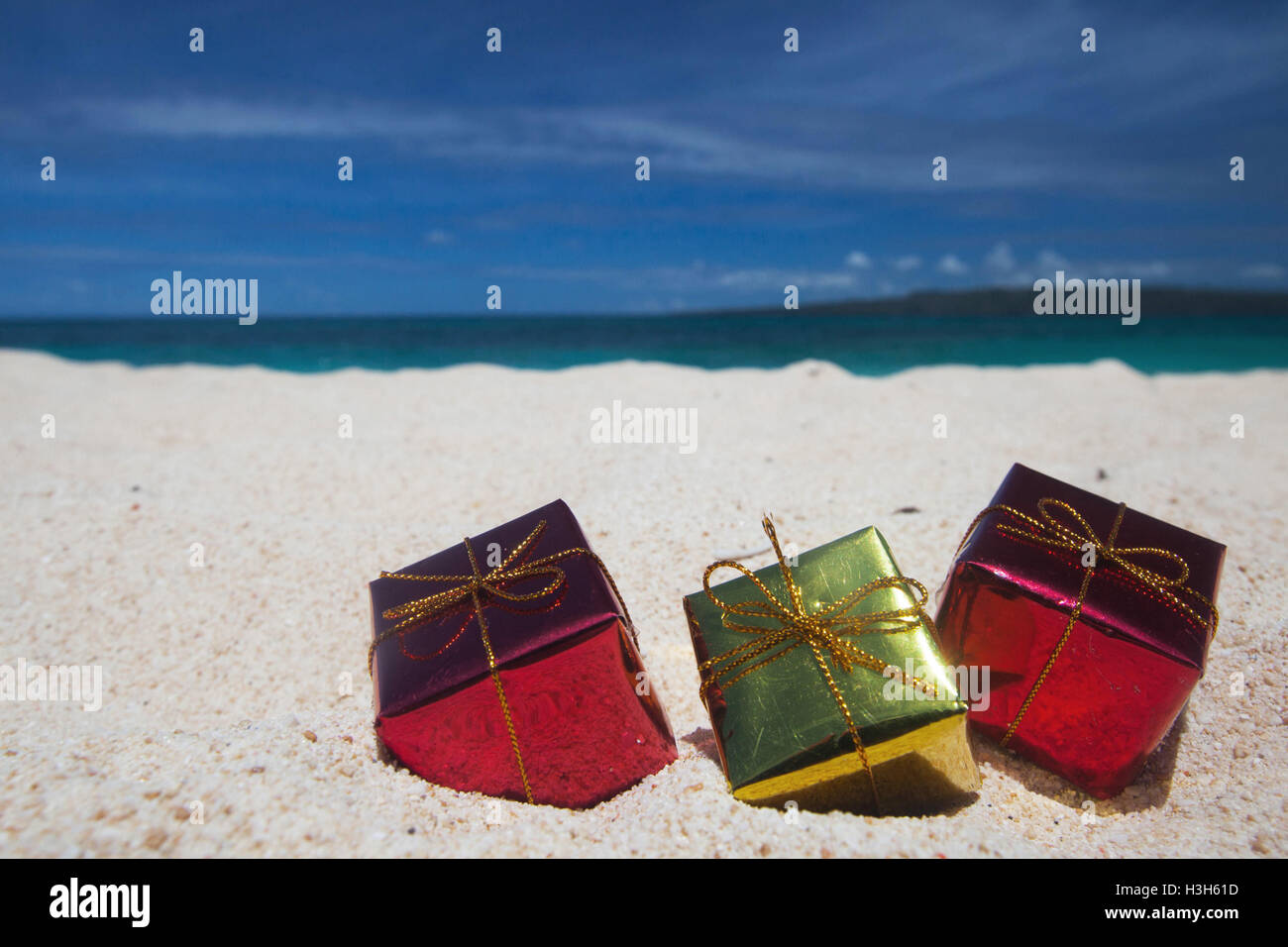 Holiday gifts on the sand of tropical sea beach Stock Photo
