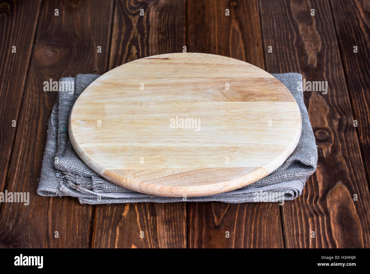 Table with round cutting board for product montage Stock Photo
