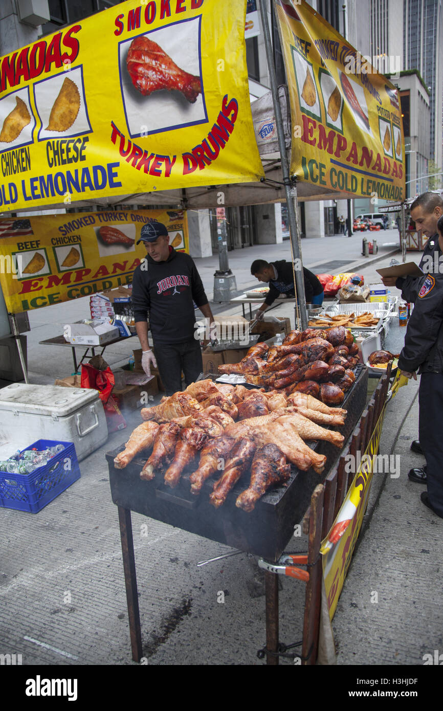 Huge cooked turkey legs for sale at a food fair in Manhattan, NYC Stock