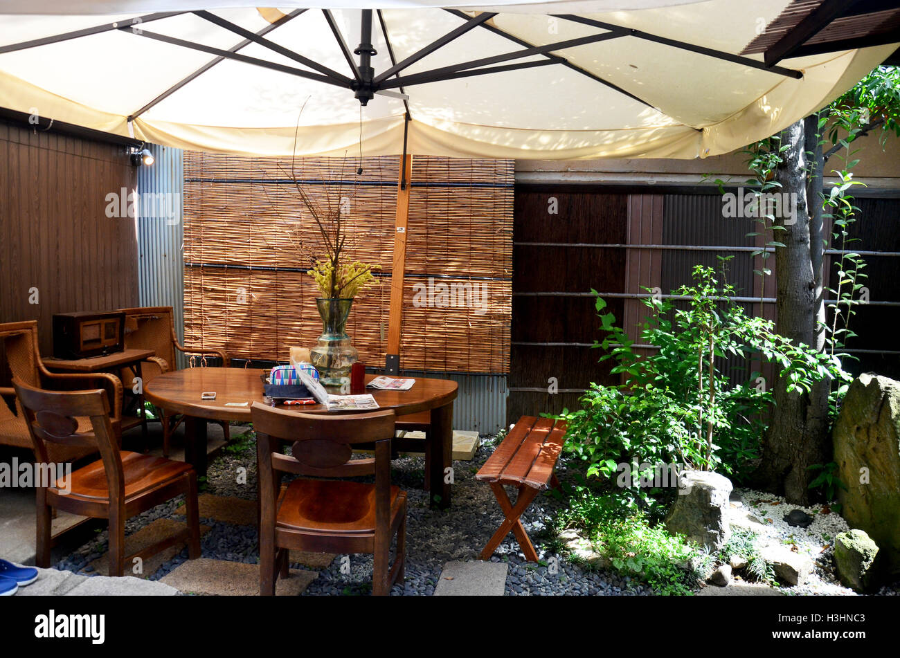 Decorative modern Wooden Furniture and umbella in the garden at outdoor