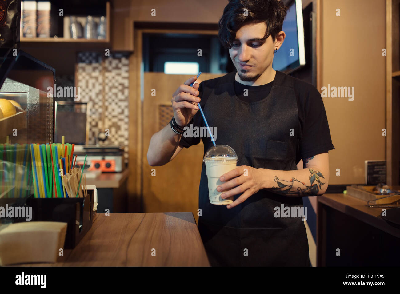 Barista at work in a coffee shop Stock Photo Alamy