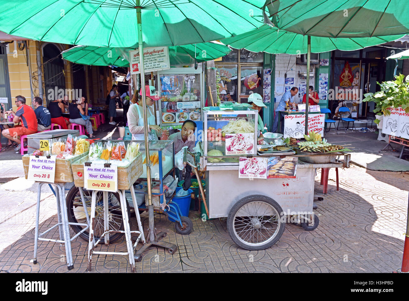 Fresh fried food for sale on a Bangkok street stall priced to satisfy any backpacker tourist. Stock Photo