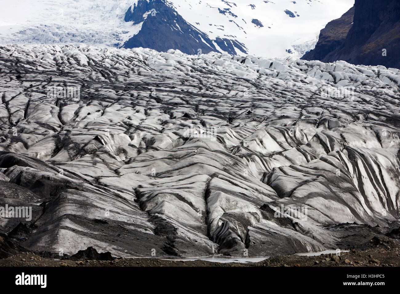 ash covered Skaftafell glacier and end moraine Vatnajokull national park in Iceland Stock Photo