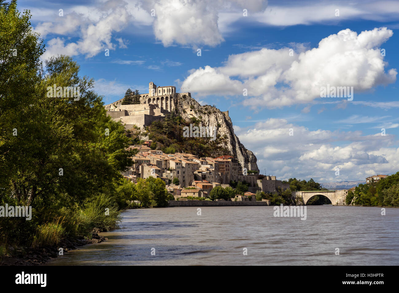 Citadel of Sisteron and Durance River on summer with clouds in afternoon light. Southern Alps (Alpes de Haute Provence). France Stock Photo