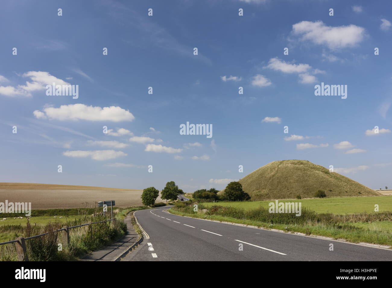 Silbury Hill in the Wiltshire countryside, is a 2400BC neolithic chalk mound, older than the Egyptian pyramids. Stock Photo