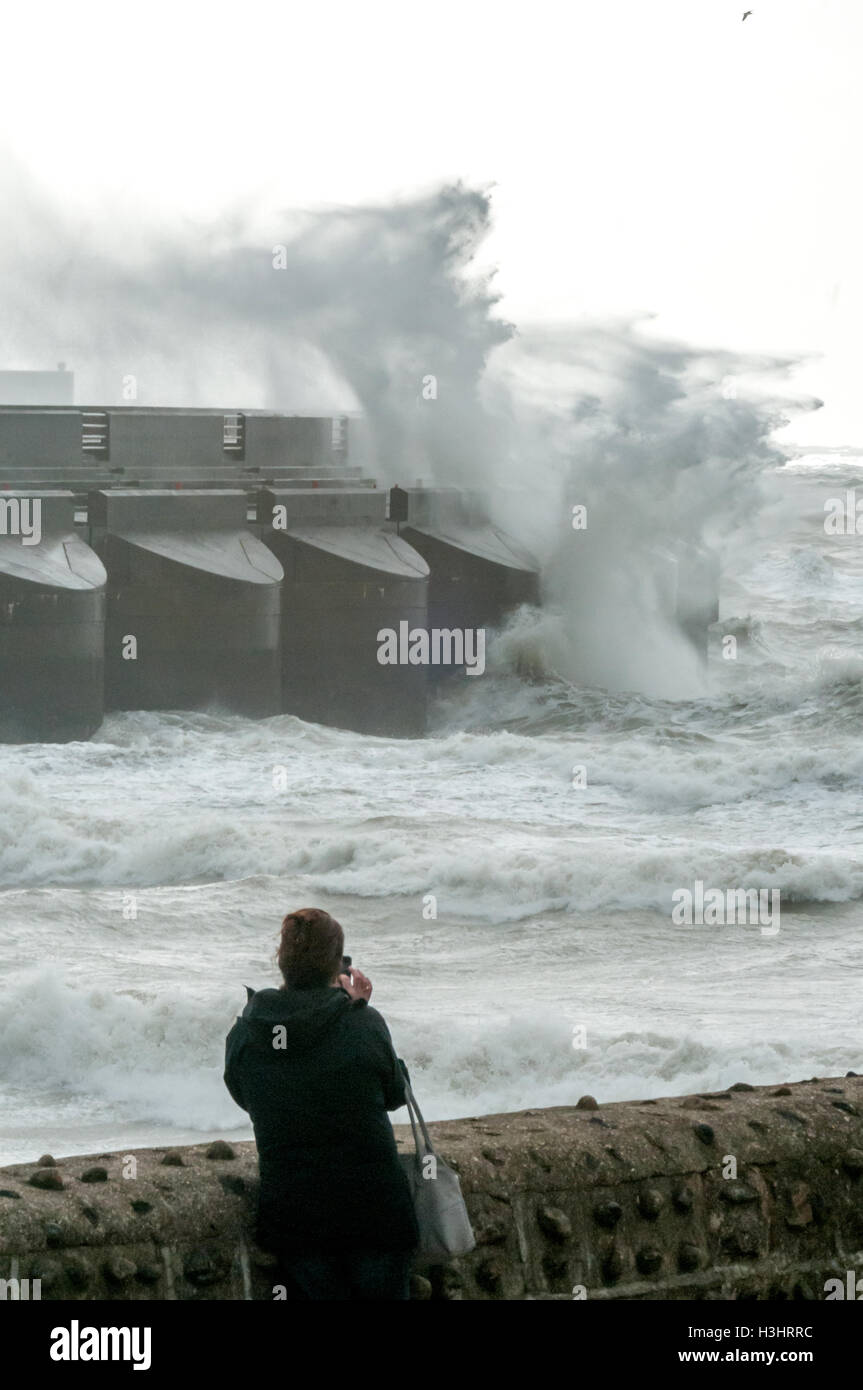 Waves crashing against the walls of Brighton Marina during a winter storm Stock Photo