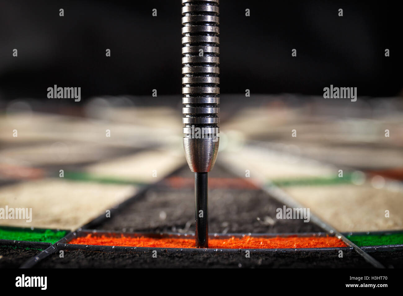 the darts hitting perfect 180 score on dart board,, close up Stock Photo Alamy